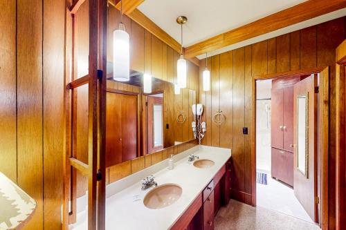 a bathroom with two sinks and a mirror at 60073 Wallowa Lake Hwy (upper unit) in Joseph