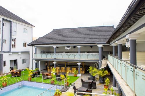 an external view of a house with a swimming pool at Wingate Exotic in Ilorin