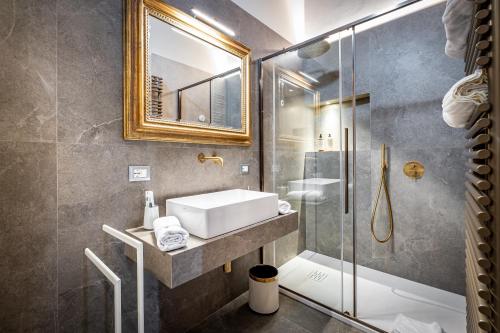 a bathroom with a sink and a shower at Dimora Collection - Le Torri - Boutique Luxury Suites - Adults Only in Florence