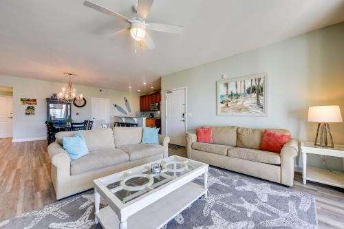 a living room with two couches and a table at Walk to Shore Roomy Condo in North Myrtle Beach! in Myrtle Beach