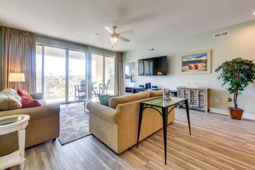 a living room with a couch and a table at Walk to Shore Roomy Condo in North Myrtle Beach! in Myrtle Beach