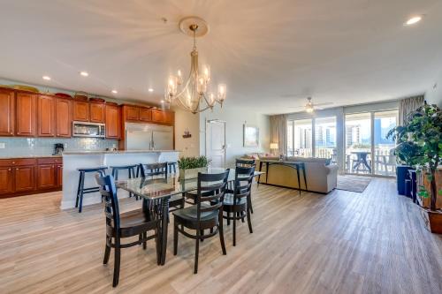 a kitchen and dining room with a table and chairs at Walk to Shore Roomy Condo in North Myrtle Beach! in Myrtle Beach
