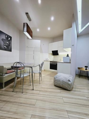 a kitchen and dining room with a table and chairs at Most City Kos in Dnipro
