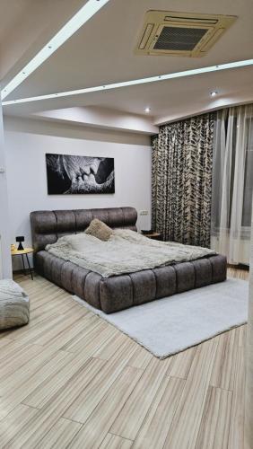 a bedroom with a large bed in a room at Most City Kos in Dnipro