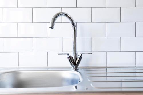 a kitchen sink with a faucet on top of it at Stanhope House in Stockton-on-Tees