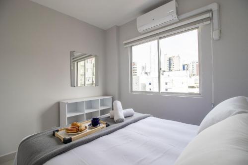 Ένα ή περισσότερα κρεβάτια σε δωμάτιο στο PFR32 - 2 DR, Climatizado, Garagem, Centro, Wi-Fi