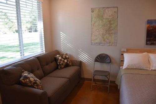 a living room with a couch and a chair at Bunkhouse 3B With Full Bath in La Verkin