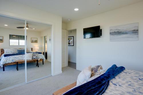 a bedroom with a bed and a tv and a mirror at Hot Tub, Mountain Views Scenic Prescott Home in Prescott