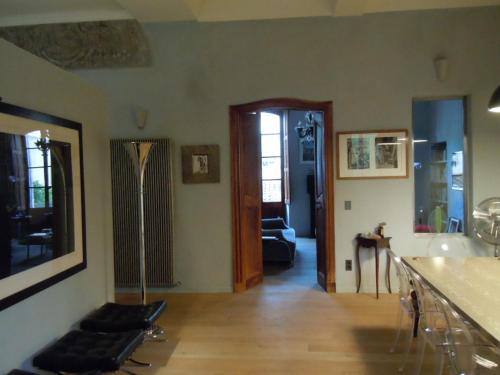 a room with a living room with a hallway at Luxury two bedroom apartment in Apt, the heart of the Luberon in Apt