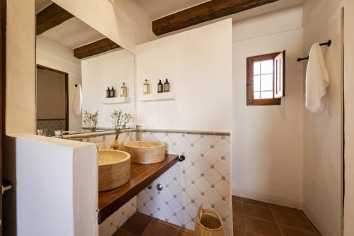 a bathroom with a sink and a mirror at CAN NOVES - Villa de 4 suites 35 y 52 in Sant Francesc Xavier