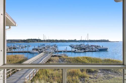 a view of a marina with boats in the water at Mariners Cay 68 in Folly Beach