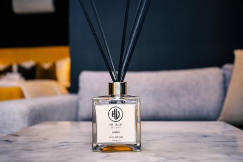a bottle sitting on top of a table at Hill Valley Asilah - Luxury Living & Boutique Hotel in Asilah