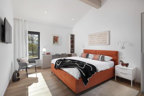 a bedroom with a bed and a desk and a chair at Villa Vesna - Premium Collection in Sveti Petar u Šumi