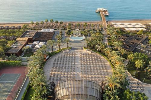 an aerial view of a resort with a pool and the ocean at Dobedan Exclusive Hotel & Spa ''Ex Brand Alva Donna Exclusive Hotel & Spa'' in Belek
