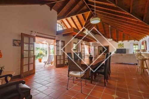 a kitchen and dining room with a table and chairs at Beautiful 5 bed-rooms Villa at Terres Basses in Friar's Bay