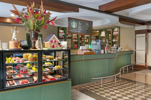 a bakery with a display case filled with food at Dobedan Exclusive Hotel & Spa ''Ex Brand Alva Donna Exclusive Hotel & Spa'' in Belek