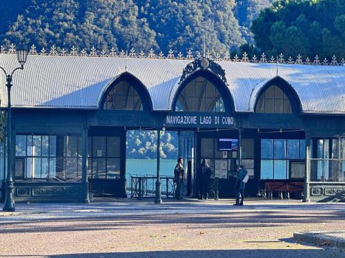 a building with people standing outside of it at Cernobbio lake suites in Cernobbio