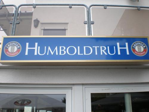
a blue and white sign on the side of a building at Humboldtruh in Weitersburg
