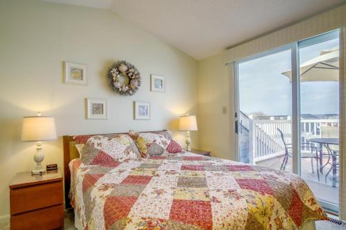 a bedroom with a bed and a view of a balcony at Walk to Ocean City Beach Condo with Rooftop Deck in Ocean City