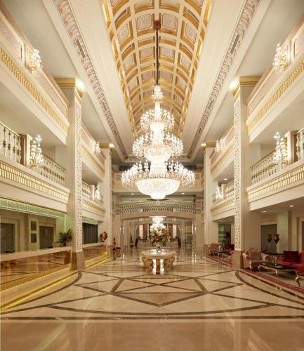 a large lobby with a chandelier and a large building at Dobedan Exclusive Hotel & Spa ''Ex Brand Alva Donna Exclusive Hotel & Spa'' in Belek