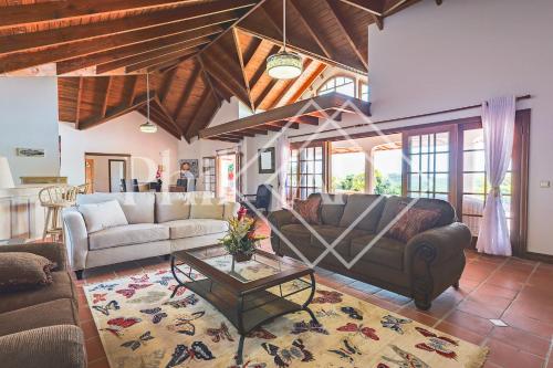 a living room with a couch and a table at Beautiful 5 bed-rooms Villa at Terres Basses in Friar's Bay