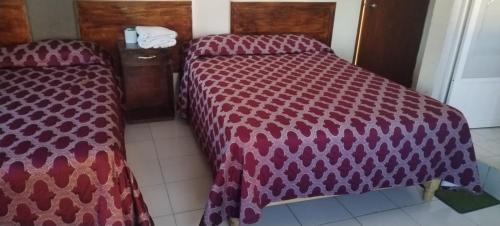 Ένα ή περισσότερα κρεβάτια σε δωμάτιο στο HOTEL MONTALVO