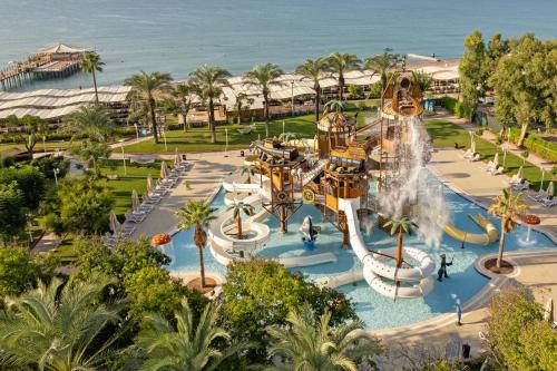 an aerial view of a water park with a roller coaster at Dobedan Exclusive Hotel & Spa ''Ex Brand Alva Donna Exclusive Hotel & Spa'' in Belek