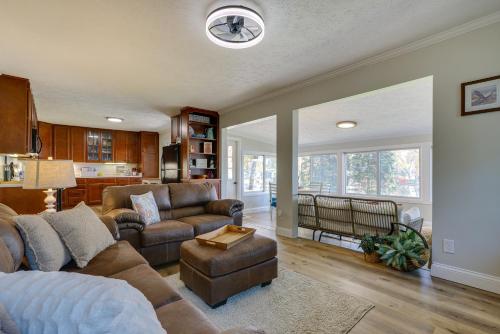 a living room with a couch and a chair at Lakefront Getaway in Leesburg with Dock and Kayaks! in Leesburg