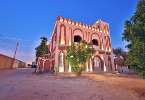 a church with a tree in front of it at El Hanna Valley View in Luxor
