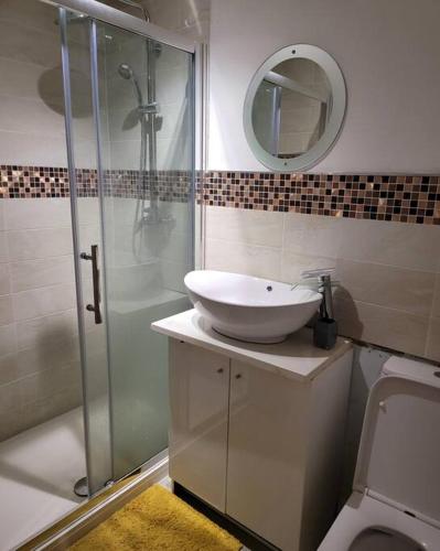 a bathroom with a sink and a shower at Cosy1 bedroom,sleeps up to4guest in Hornchurch