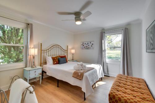 a bedroom with a bed and a window at Tranquil Travelers Rest Home with Fire Pit! in Travelers Rest