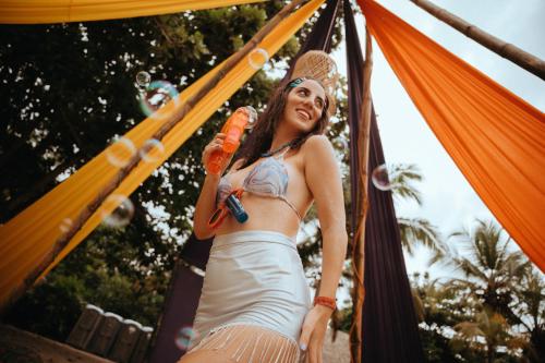 a woman in a dress is riding on a roller coaster at Viajero Tayrona Hostel & Ecohabs in Buritaca