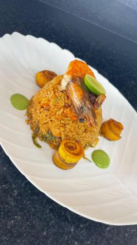 a white plate topped with food on top at PUNTA COCO VILLAS BEACH in Cojimíes