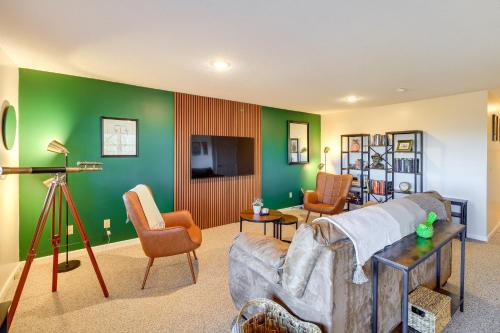 a living room with green walls and a couch and chairs at Mtn-View Blue Ridge Cabin on Over 2 Acres! in Sparta