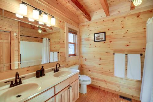 a log cabin bathroom with a sink and a toilet at Mtn-View Blue Ridge Cabin on Over 2 Acres! in Sparta