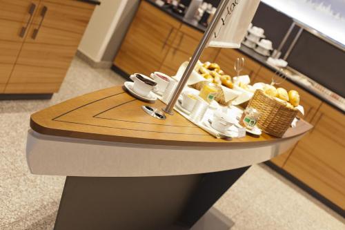 a table with food on it in a kitchen at Hotel Hagnauer Seeperle in Hagnau