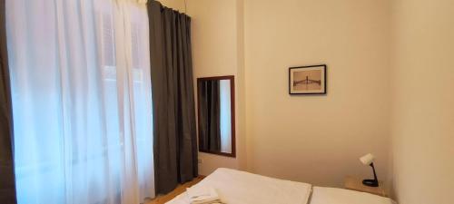 a bedroom with a bed and a window at Thomas Apartments in Berlin