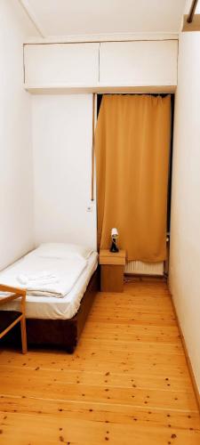 Ένα ή περισσότερα κρεβάτια σε δωμάτιο στο Pension Thomas Rooms