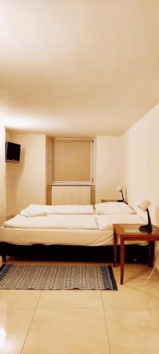 Ένα ή περισσότερα κρεβάτια σε δωμάτιο στο Pension Thomas Rooms