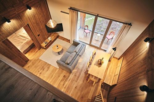 an overhead view of a living room with a table and chairs at Aldrov Resort in Vítkovice