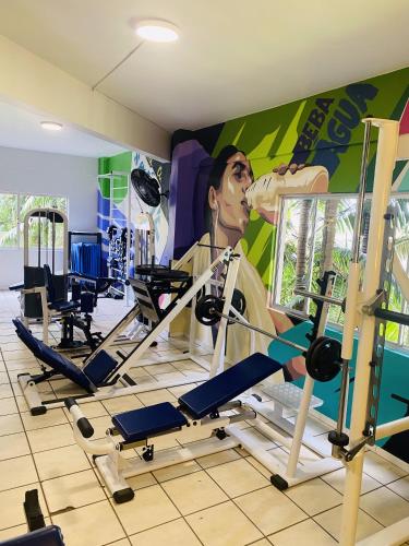 a gym with cardio equipment and a painting on the wall at Real NOB Hotel in Orleans