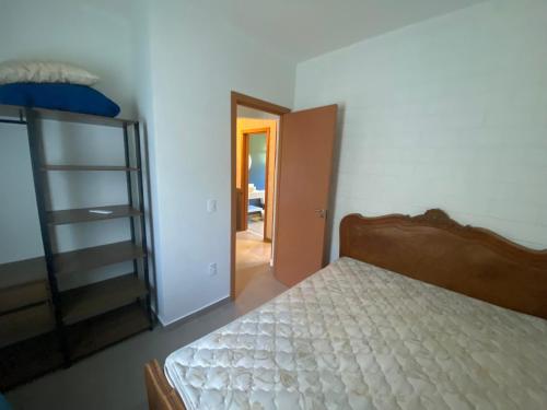 A bed or beds in a room at Paúba Beach House