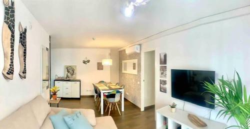 a living room with a couch and a table at Cristimar H23 big pool, 3 bedroom and 3 baths in Los Cristianos