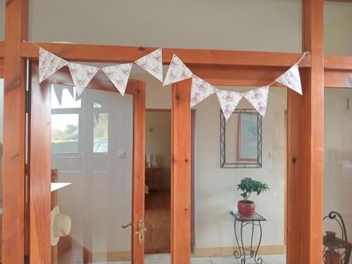 a room with a door with a banner on it at Coastal village retreat in Castletownshend