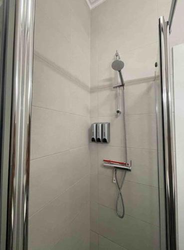 a shower with a glass door in a bathroom at Cantinho de Sagres in Sagres