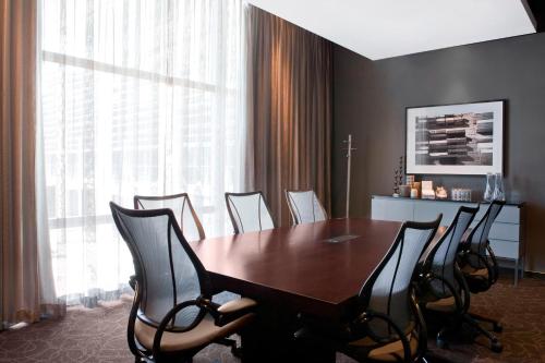 a conference room with a wooden table and chairs at The Westin Cape Town in Cape Town