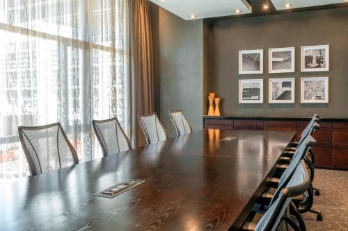 a conference room with a large wooden table and chairs at The Westin Cape Town in Cape Town