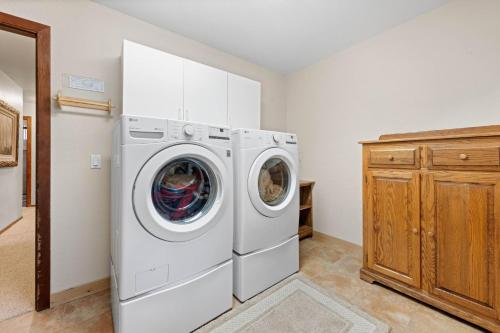 a white washer and dryer in a room at Nightingale Retreat by Tahoe Getaways - 3BR, Close to Tahoe City, Walk to Bike Path & Private Beach Access in Tahoe City