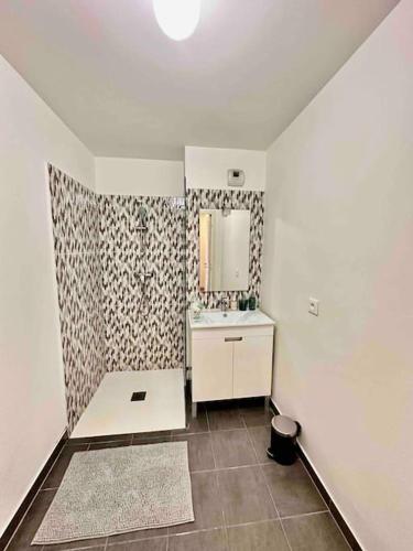 a bathroom with a sink and a mirror at Magnificent apartment Paris Bagnolet 201 in Bagnolet