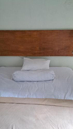 A bed or beds in a room at Suburdi Guest House
